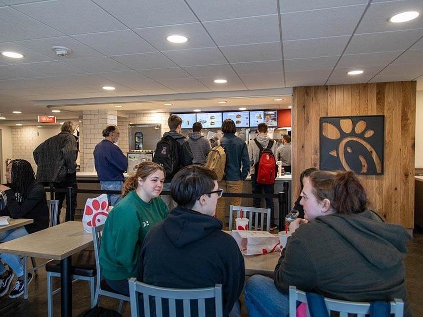 Students eating at the Chick-fil-A restaurant on campus